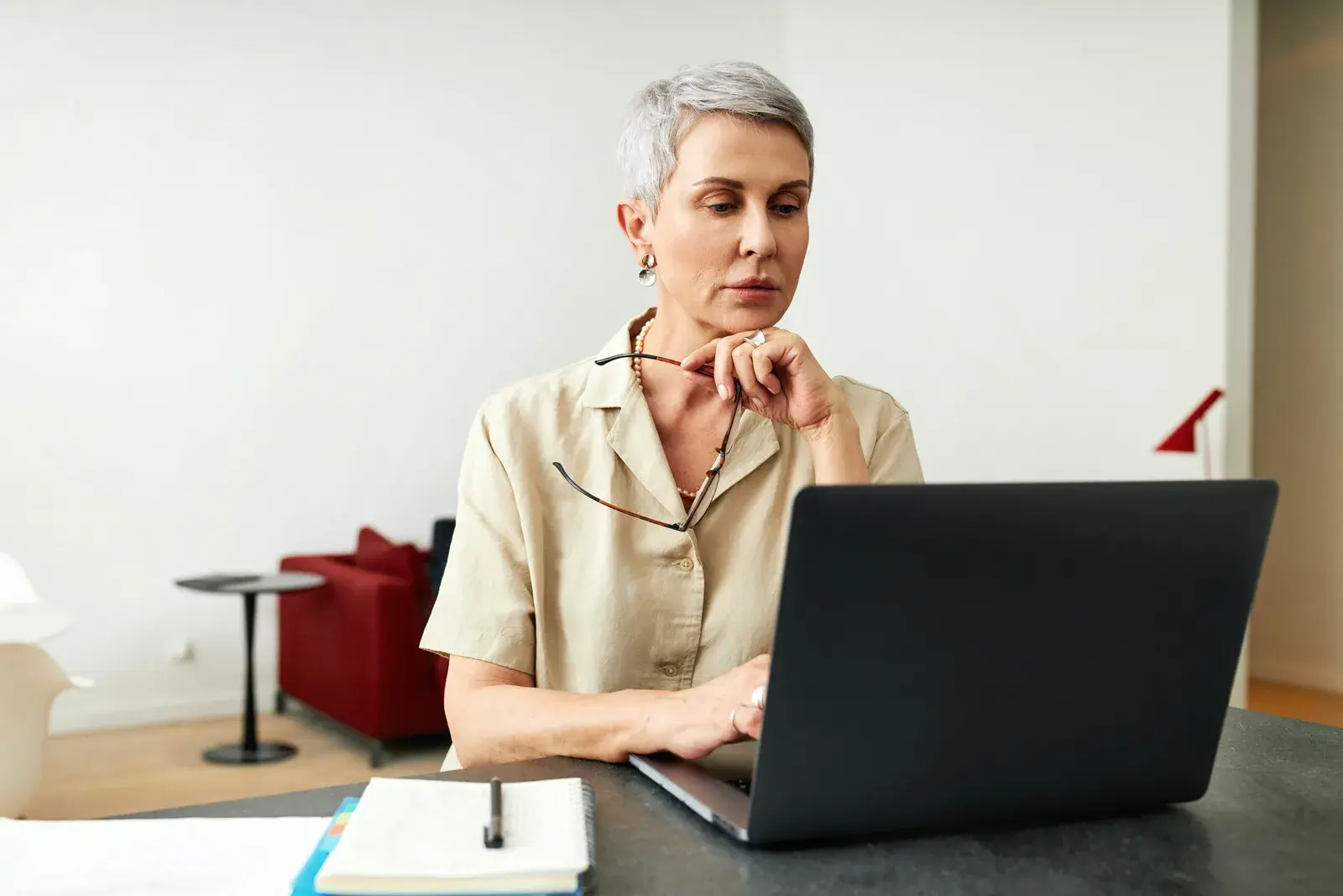 Woman reading from a laptop