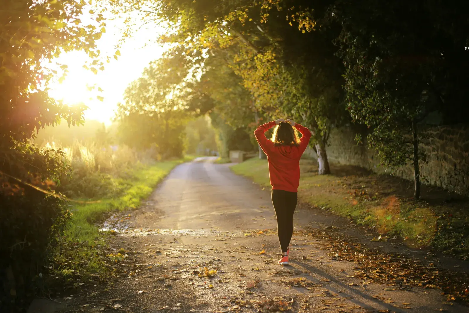 Woman walking down a country lane