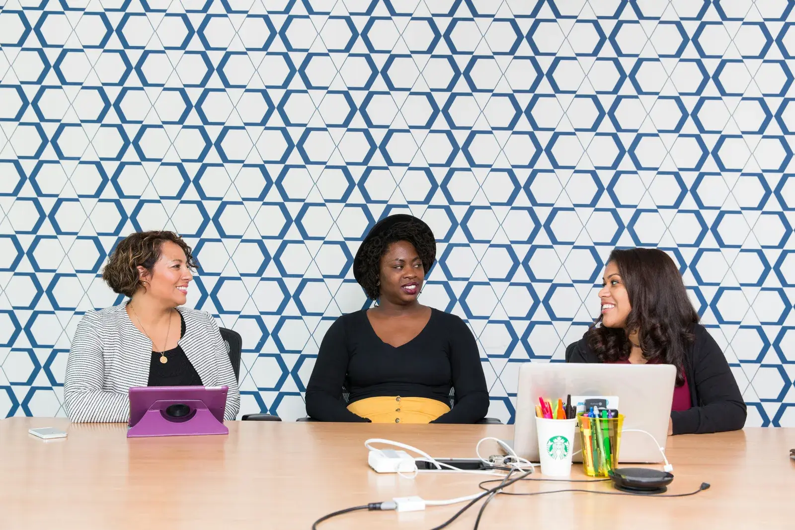 Midlife women working at a conference table